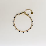 Gouden armband zwarte kraaltjes met verlengstukje