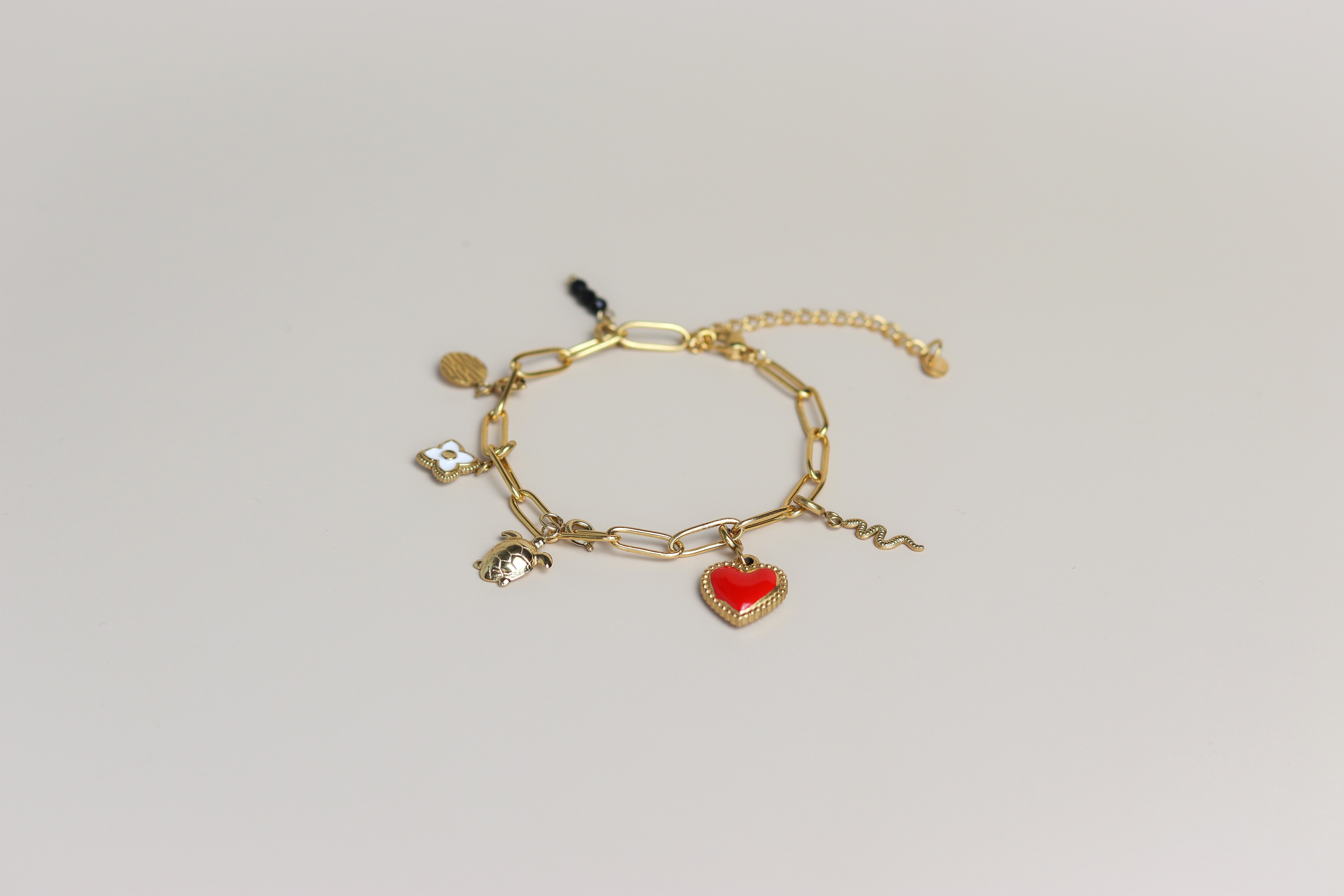 Gouden schakelarmband met bedels