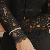 Armband van beige kralen-goud