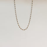 Ketting met zwarte bolletjes-goud