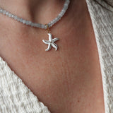 Ketting van lichtblauwe kralen-goud