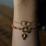 Armband van roestbruine kralen-goud