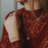 Armband plat gedraaid-goud