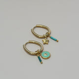 Groene ronde bedel met ster-goud