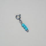 Knijpbedel turquoise rondje kraaltjes-zilver