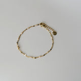 Armband met beige kraaltjes- goud