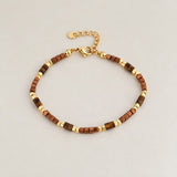Armband bruin met gouden kraaltjes-goud