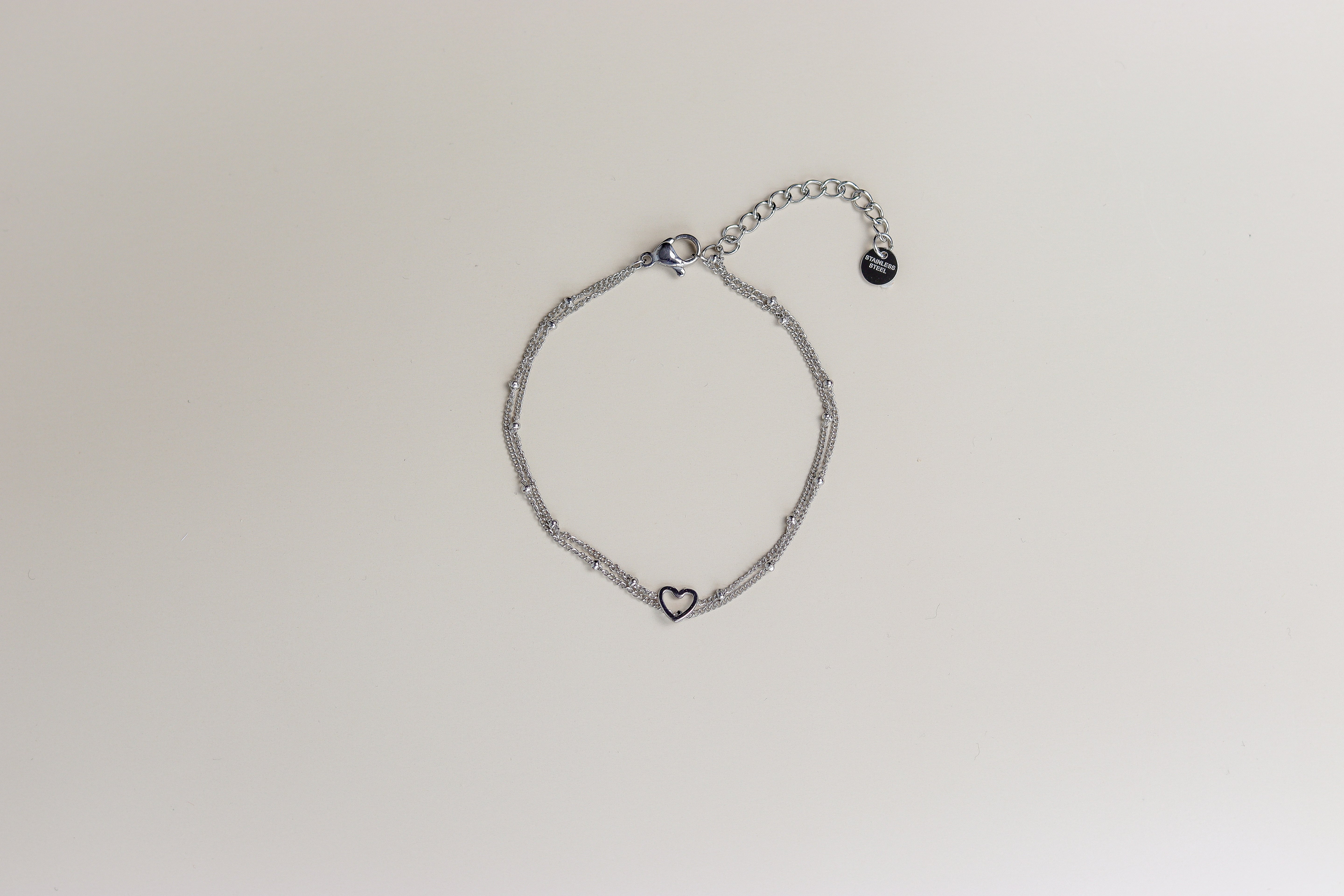 Zilveren dubbele armband met open hartje en verlengstukje