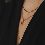 Ketting met zwarte bolletjes-goud